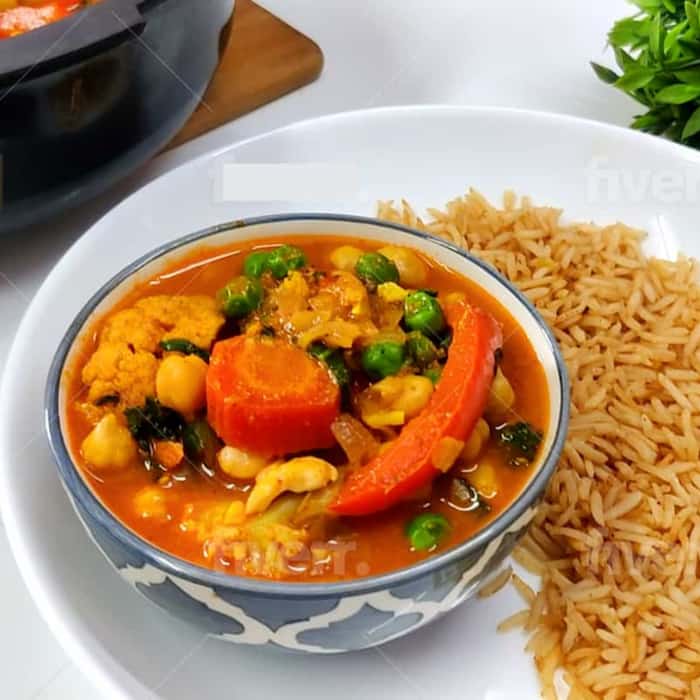 cauliflower and chickpea curry next to wholegrain rice